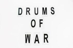 Text DRUMS OF WAR on white background, copy space photo