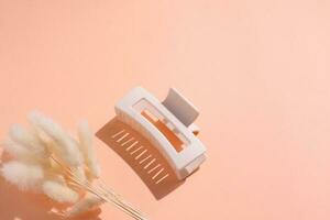 Hair clip, beige stylish claw, copy space photo