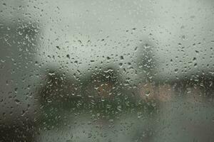 Wet glass. Raindrops on window. It's rainy day. photo