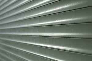 Blinds on window. Plastic shutters. Ribbed surface. photo