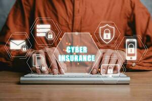 Cyber security data protection business technology privacy concept, Businessman typing on keyboard with cyber insurance icon on virtual screen, Cyber insurance concept. photo