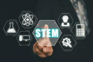 STEM concept, science, technology, engineering, mathematics, Businessman hand touching STEM icon on virtual screen. photo