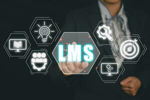 LMS, Learning Management System concept, Business person hand touching LMS icon on virtual screen, online education, course, application, study, elearning. photo