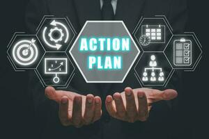 Action plan strategy vision planning direction concept, Business person hand holding action plan icon on virtual screen. photo