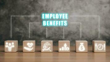 Employee Benefits Career Concept, Wooden block on desk with Employee Benefits icon on virtual screen. photo