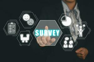 Survey concept, Business person hand touching survey icon on virtual screen. photo