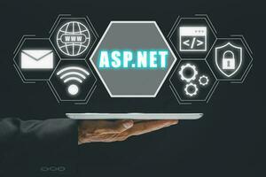 asp.net desarrollo programación idioma concepto, persona utilizando tableta con asp.net icono en virtual pantalla. foto