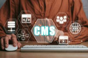 CMS, Content management system concept, Person hand touching Content management system icon on virtual screen background, business web computer website administration. photo