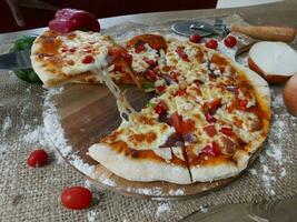 This professional photo captures the essence of a perfect pizza masterpiece. The composition is visually stunning, with the pizza positioned as the focal point against a simple backdrop.