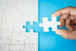 Human hands holding jigsaw with word problem  solution. symbol of association and connection. business strategy. photo