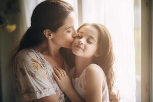 Mother hugs and kisses daughter on the cheek while smiling. photo