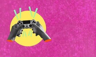 Art collage, hands with the game joystick on pink background with space for advertising. photo