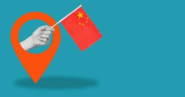 Art collage, a woman's hand showing the flag of China with a navigation icon, on a blue background with room for copying. photo