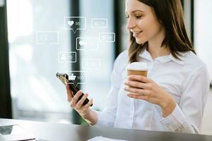 Social media and Marketing virtual icons screen concept. close up of businesswoman typing keyboard tablet with laptop computer  and smart phone in office photo