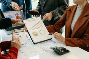 Business team meeting. professional investor working new start up project. Finance task. with smart phone and laptop and digital tablet computer photo
