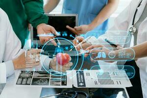 Medical technology network team meeting concept. Doctor hand working with smart phone modern digital tablet and laptop computer with graphics chart interface, with virtual icon photo