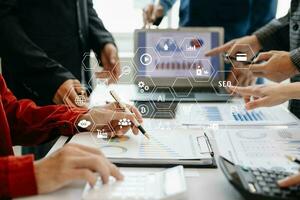 Working team meeting concept, business using laptop and smart phone and digital tablet computer with digital marketing media  in virtual icon network diagram office photo
