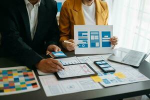 UX graphic designer planning application process development prototype wireframe for web smart phone. Creative digital development agency. photo
