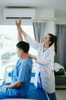 Doctor consulting with patient Back problems Physical therapy concept photo