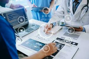 Medical technology network team meeting concept. Doctor hand working with smart phone modern digital tablet and laptop computer with graphics chart interface, with virtual icon photo