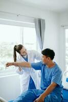 Doctor consulting with patient Back problems Physical therapy concept photo