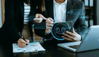 Man and woman using chat bot in smartphone intelligence Ai. Chat with AI Artificial Intelligence, developed by OpenAI generate. robot in online system. in modern office photo