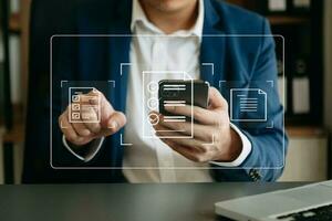 E-document management Paperless workplace, e-signing, electronic signature, document management. businessman signs an electronic document on a virtual notebook screen using a stylus pencil. photo