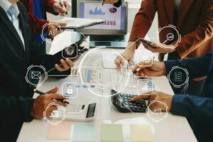 Working team meeting concept, business using laptop and smart phone and digital tablet computer with digital marketing media  in virtual icon network diagram office photo