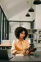 Business woman using tablet and laptop for doing math finance on an office desk, tax, report, accounting, statistics, and analytical research concept in office photo