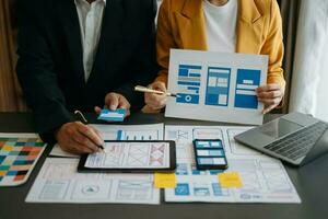 UX graphic designer planning application process development prototype wireframe for web smart phone. Creative digital development agency. photo
