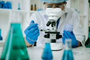 Male biotechnologist testing new chemical substances in a laboratory. photo