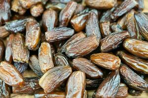 Fruits of the date palm Phoenix dactylifera Finger of light photo