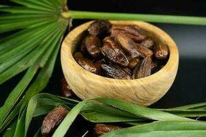 Fruits of the date palm Phoenix dactylifera Finger of light photo