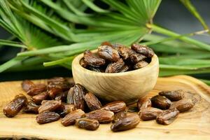 Fruits of the date palm Phoenix dactylifera Finger of light photo