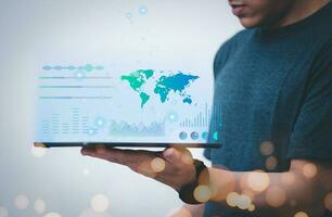 Businesses use phones to virtual hologram data graphs online. with internet technology concept of global data connection with technology internet big data searching for information online marketing photo