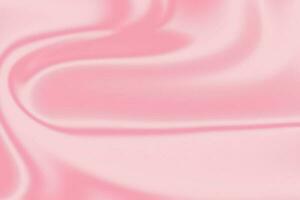 Pink satin abstract background with smooth lines for design. photo