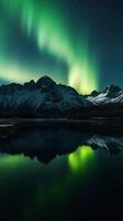 Beautiful Northern Lights above mountain and river. photo