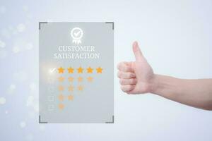 Satisfaction survey and customer service concept, businessman using a smartphone to answer the questionnaire and give a satisfaction rating, offering a 5-star satisfaction rating photo