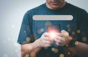 Information search technology, search engine optimization, male hand using a smartphone to search information, using search bar function on your website photo