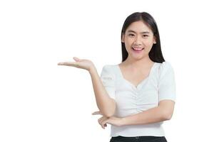 Portrait young Asian woman is smiling and shows her hands to present something isolated on white background. photo