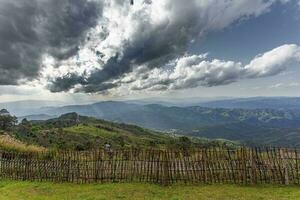 Beautiful wooden border fence above the mountains of northern Thailand. photo