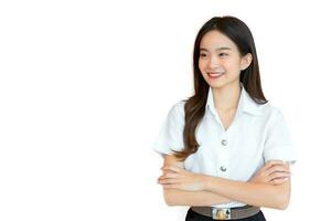 Portrait of adult Thai student. Cute Asian young woman student in uniform is smiling with her arms crossed confidently isolated on white color background in the university photo