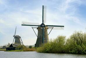 Netherlands colorful country of windmills and tulips flowers photo