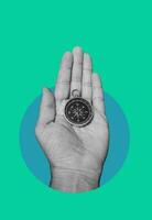 Compass in a human's hand. Business development in the right direction. photo