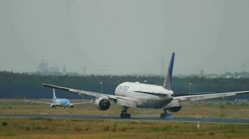 FRANKFURT AM MAIN, GERMANY JULY 20, 2017 - United Airlines Boeing 777 N226UA landing at runway 25L, slow motion. Fraport, Frankfurt, Germany video