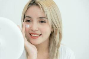 Young woman asian are worried about faces Dermatology and allergic to steroids in cosmetics. sensitive skin, red face from sunburn, acne, allergic to chemicals, rash on face. skin problems and beauty photo