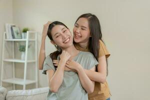 LGBT. Asian lesbian couple smiling and showing love at home. Young asian couple hugging each other happily, lovers, homosexuality, homosexuality, freedom, expressions, relationship photo