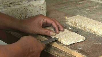 Close up of hands slicing tempeh. video