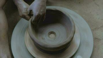 close up of craftsman's hands making pottery from clay video
