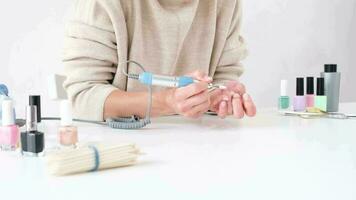 woman doing manicure with nail polish, Manicure at home for yourself. A woman's hand with healthy natural nails. video